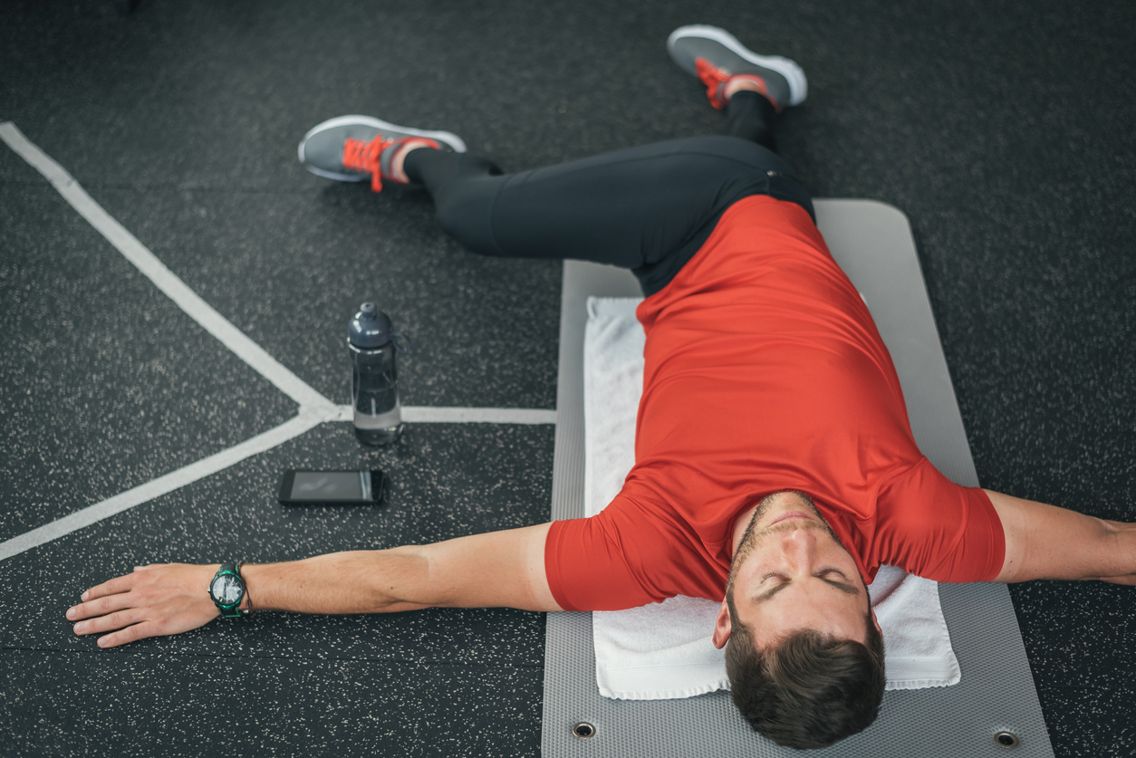 A man performing piriformis stretches to get rid of sciatica, lower back, or hip pain